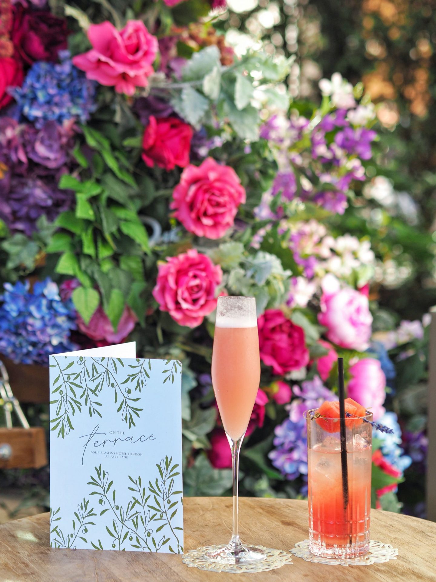 Peach Bellini and Watermelon Cooler on Floral Background